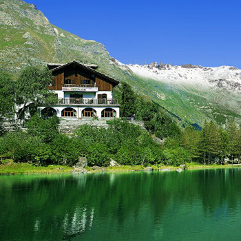 Chalet sul lago hotel restaurant on mountain. Mont Cenis
